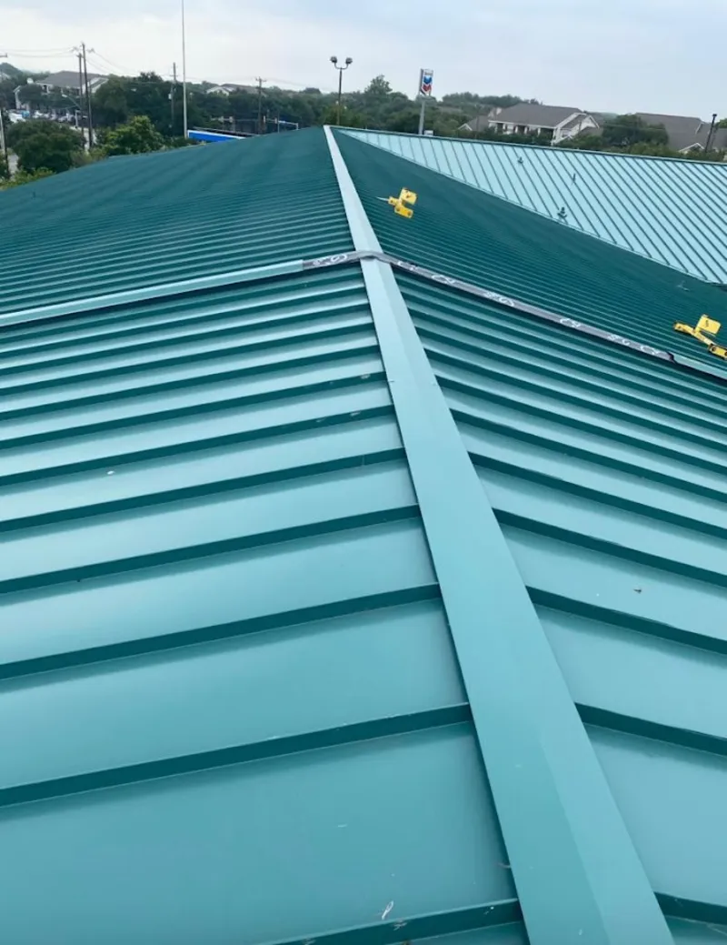 Green commercial metal roof ridge and valley for Metal Roof Repair in Ishpeming